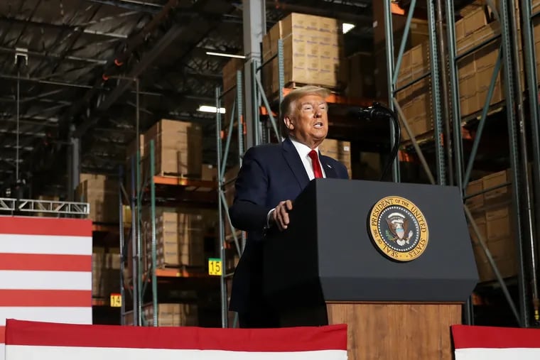 President Donald Trump speaks to workers during a visit to the Owens & Minor medical equipment distribution center just outside Allentown, Pa., on May 14, 2020.