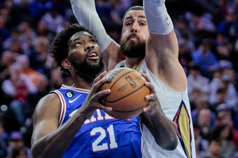 Sixers Joel Embiid drives on Pelicans Jonas Valanciunas during the third quarter at the Wells Fargo Center on Monday.