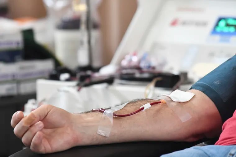 A person donates blood to the American Red Cross during a blood drive in Pottsville, Pa. on Jan. 13, 2022.