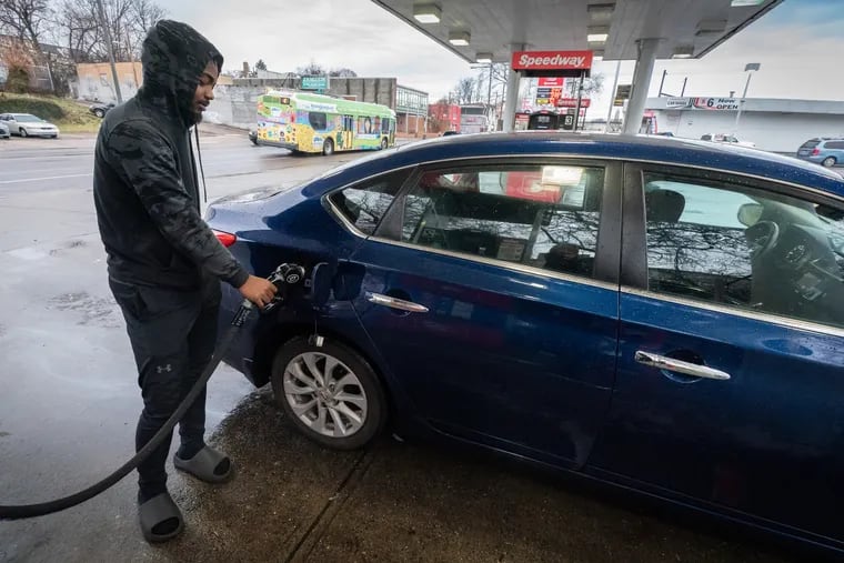 Rasheem Harrison puts gas in his car at a Speedway gas station in Philadelphia, Thursday, February 16, 2023.