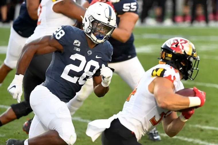 Penn State defensive end Jayson Oweh (28) chases Maryland running back Jake Funk in a game on Nov. 7.