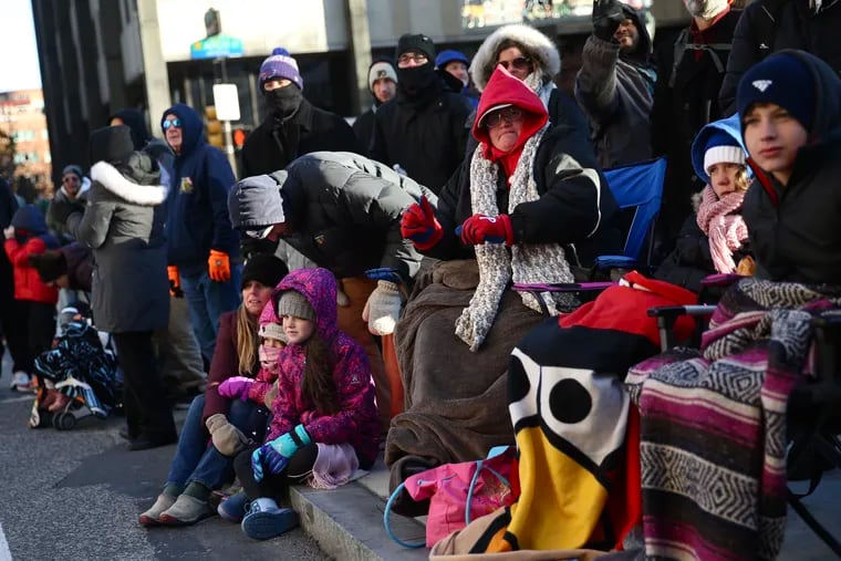 Spectators bundle up to watch the annual Thanksgiving Day parade in Center City Philadelphia on Thursday, Nov. 22, 2018. Temperatures were forecast to reach only into the 20s.