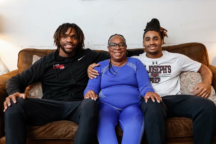 Rhonda Hall-Norris had a big influence on her grandsons, Imhotep's Zahir Mathis (left) and St. Joe's Prep's Samaj Jones. Jones is heading to Cincinnati next season, and Mathis has offers from multiple Power Five schools.