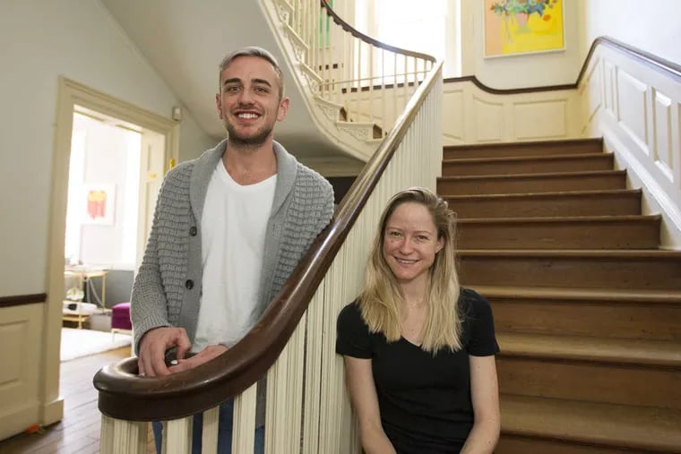 Alex Aberle and Violette Levy on the main stairway of their home, the historic Upsala mansion.