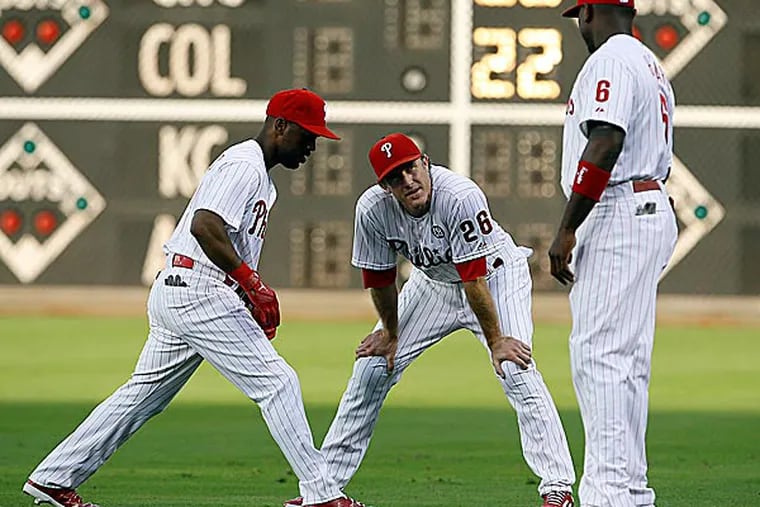 Phillies shortstop Jimmy Rollins, second baseman Chase Utley and first baseman Ryan Howard. (Yong Kim/Staff Photographer)