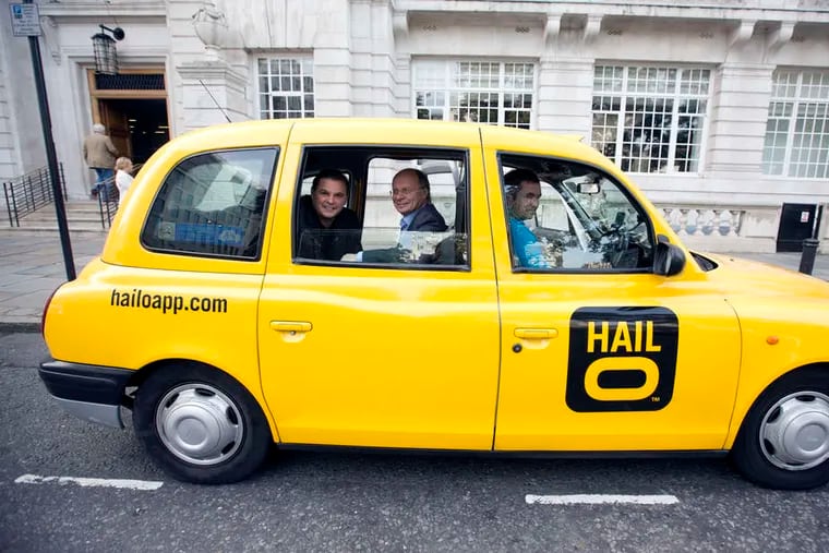 Gary Jackson (left), co-founder of Hailo Network Ltd., and Ron Zeghibe, chairman and co-founder, in a London taxi. Hailo, a smartphone app that lets the user hail a cab, will be available in New York this December after a state appeals panel cleared the way for a pilot program to go ahead.