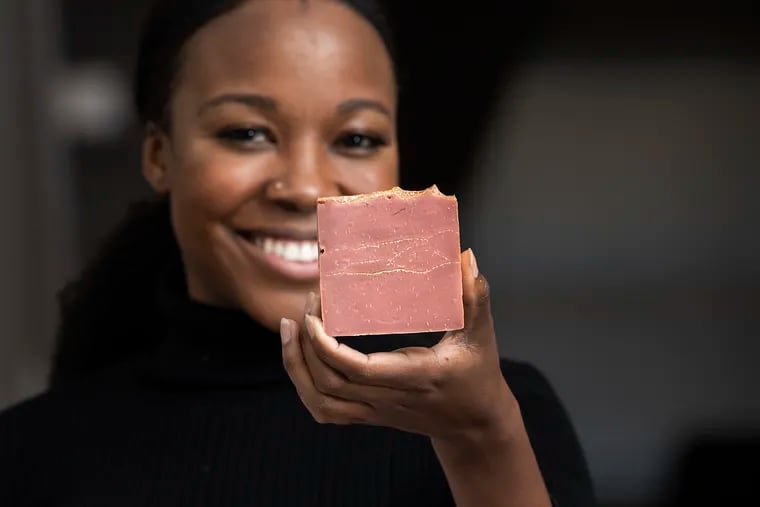 Chartel Findlater is photographed with her signature soap in Philadelphia, Pa. Tuesday, October 27, 2020. Chartel is the founder of Gold + Water, a Black-owned soap and body care company.