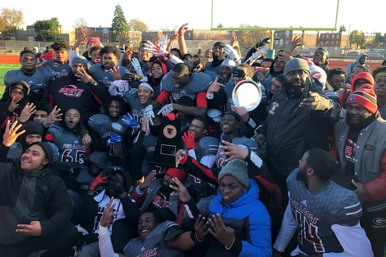 Gratz players celebrates after winning their fourth straight Public League football title on Saturday.