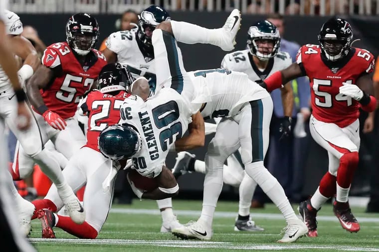 Corey Clement flipping over Falcons safety Damontae Kazee during a kickoff return last month.