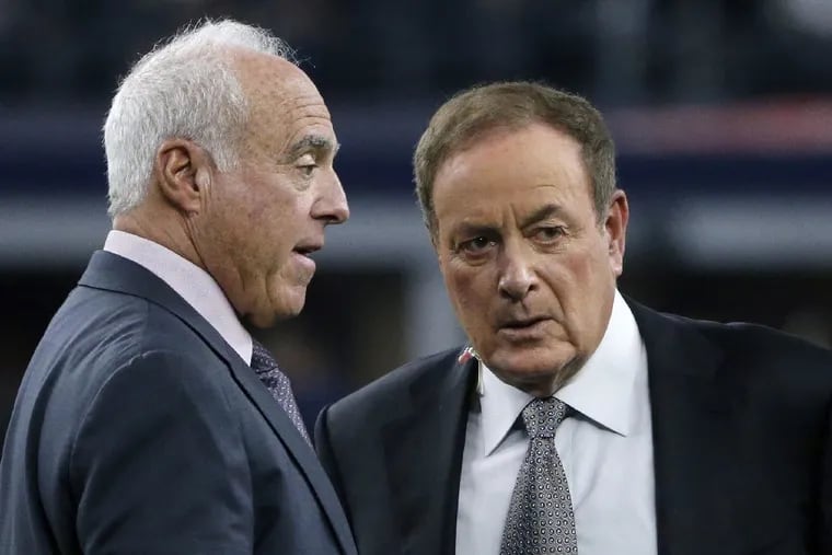 NBC broadcaster Al Michaels (right) chats with Eagles owner Jeffrey Lurie last season. Michaels returns after a "bye week" to call Sunday night's Eagles-49ers game on "Sunday Night Football."