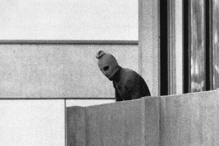 One of the most iconic images of the 1972 Munich Olympics: A member of the Black September terror group on the balcony of the Israeli team's quarters.

FILE PHOTOS