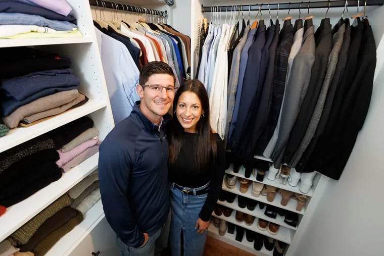 Javier and Melanie Bermudez with their remodeled main bedroom closet in their Point Breeze home.