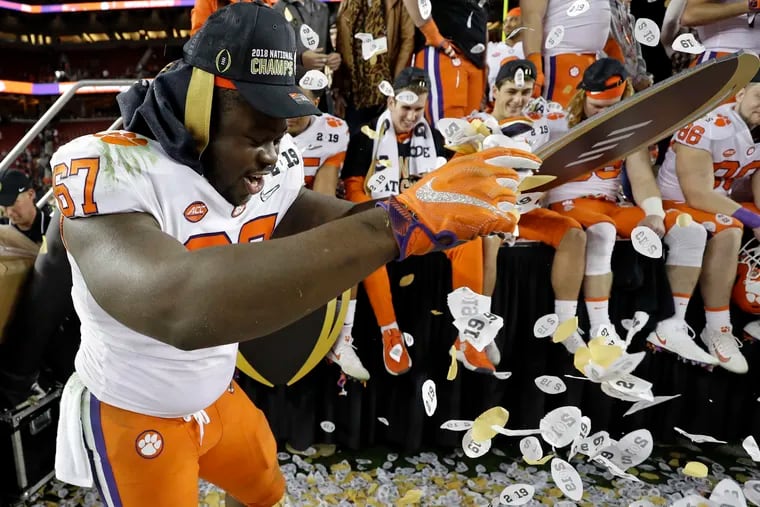Albert Huggins, then with Clemson, celebrates after the team's college football championship victory over Alabama in January.