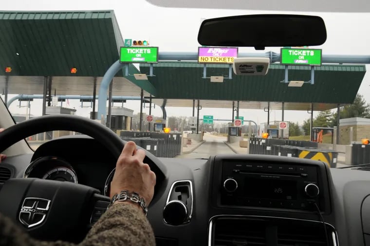 White E-Z Pass transponder properly placed behind the rear-view mirror