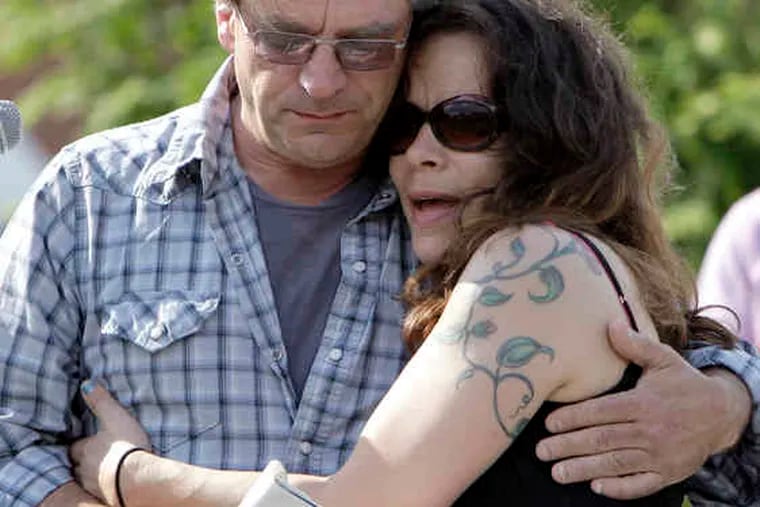 At left, Sabina Rose O'Donnell's mother and stepfather, Rachel O'Donnell and Mark Rounds, comfort one another. At right, a tearful Talia Bella, who sang a song in Sabina's memory.