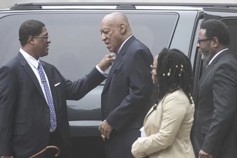 Bill Cosby, center, arrives Wednesday for the third day of jury selection in his sexual assault case at the Montgomery County Courthouse in Norristown.