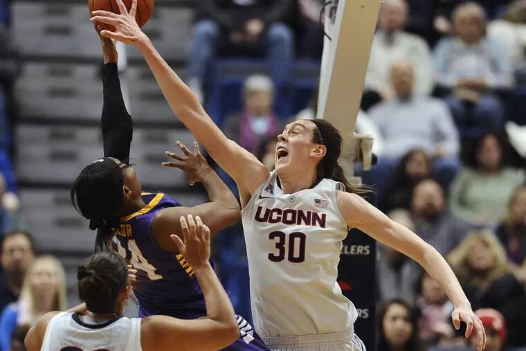Connecticut's Breanna Stewart, right, blocks a shot attempt by East Carolina's I'Tiana Taylor as Connecticut's Kaleena Mosqueda-Lewis, left, defends. (AP Photo/Jessica Hill, File)