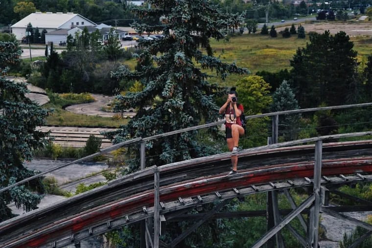 Rebecca Bunting, who was popular in the urban exploration community, takes photos in an abandoned amusement park. 