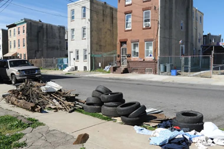 The 2000 block of North Third Street, near Diamond Street, is a popular dumping site for tires and other refuse. (Clem Murray / Staff Photographer)
