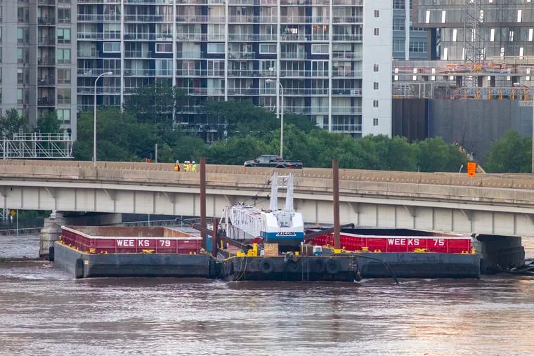 Barge hits I-676 ramp to I-76 in Center City Philadelphia, closing road to traffic during morning commute. Remains of heavy rain from Tropical Storm Isaias that passed over Philadelphia on Tuesday left its damage on Wednesday morning August 5, 2020.