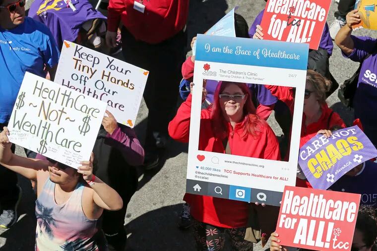 In this March 23, 2017, file photo, hundreds of people march through downtown Los Angeles protesting President Donald Trump's plan to dismantle the Affordable Care Act, his predecessor's signature health care law.
