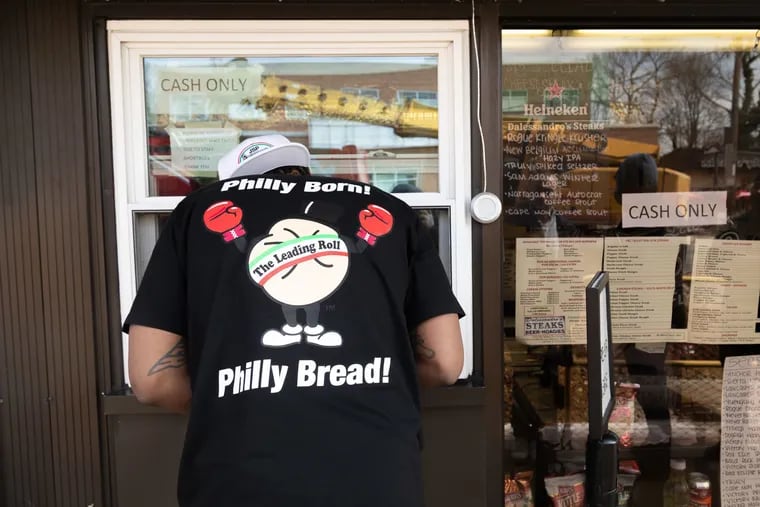 Dom Rivers places an order at Dalessandro's in Roxborough while wearing gear from JSP and Amoroso's Extra Collection.