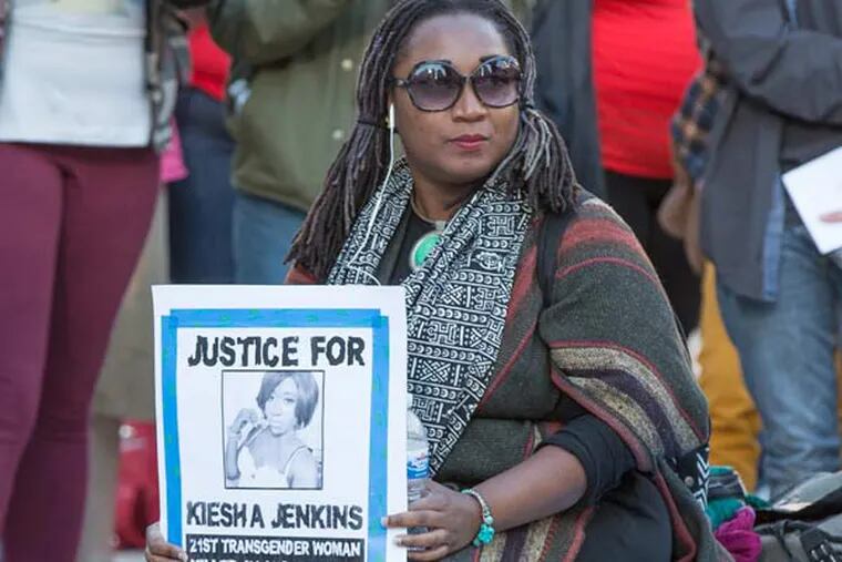 Several hundred members of Philadelphia's LGBT community turned out  for a rally and march this afternoon which started at Thomas Paine Plaza across from City Hall and ended on South Broad Street. The event was to show support for transgender community. Here, Erica Mine, a member of the Philly Coalition for Real Justice
holds a sign calling for justice for Kiesha Jenkins , a recently murdered transgender woman (ED HILLE / Staff Photographer)