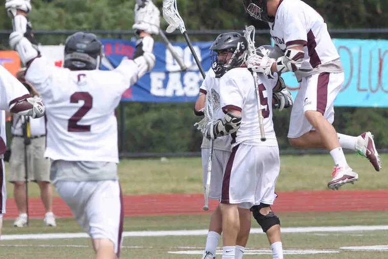 Conestoga players celebrate a goal in the final seconds of the second quarter that gave them an 8-0 lead. The Pioneers went on to defeat Central Bucks East, 14-4, in the state semifinals.