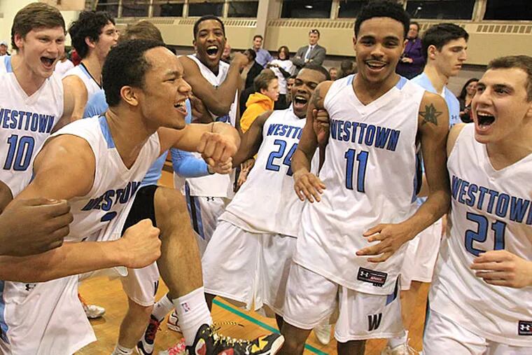 Jair Bolden, center, leads the Westtown players as they celebrate
their 65-39 victory over Academy of the New Church. (Charles Fox/Staff Photographer)