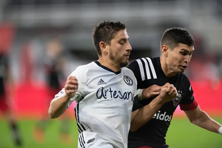 Alejandro Bedoya (left) battles against Edison Flores in the Union's 2-2 tie Wednesday at D.C. United.