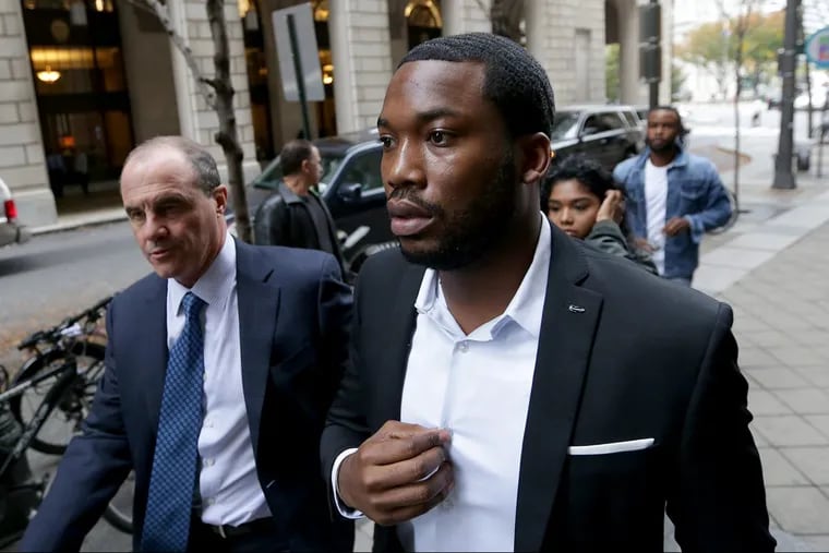 Rapper Meek Mill, right, arrives at the Criminal Justice Center with his lawyer Brian McMonagle, left, in Philadelphia on Nov. 6, 2017.