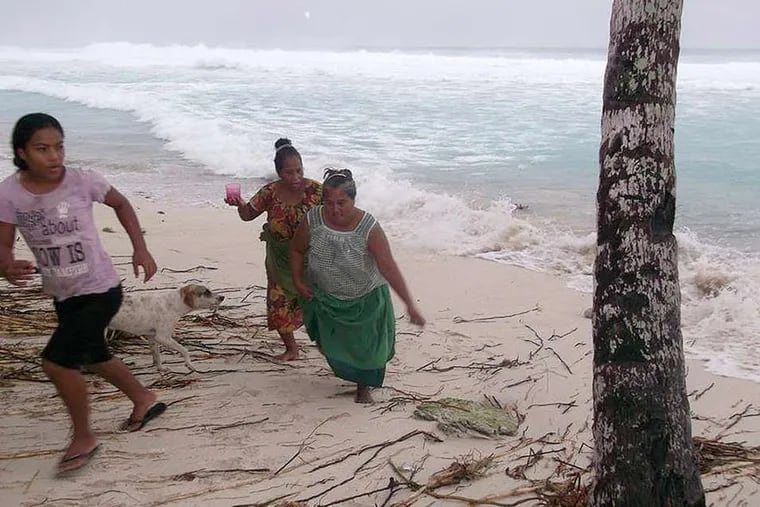 On the island of Kiribati, top right, residents move away