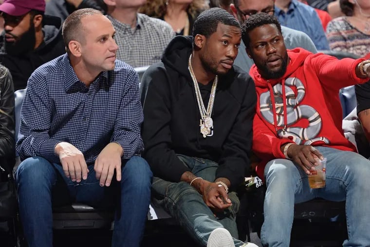 Michael Rubin (left) at a Philadelphia 76ers game with Meek Mill (center) and Kevin Hart.