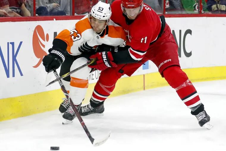 The Flyers' Shayne Gostisbehere (53) and the Hurricanes' Jordan Staal vie for the puck in the teams’ last meeting.