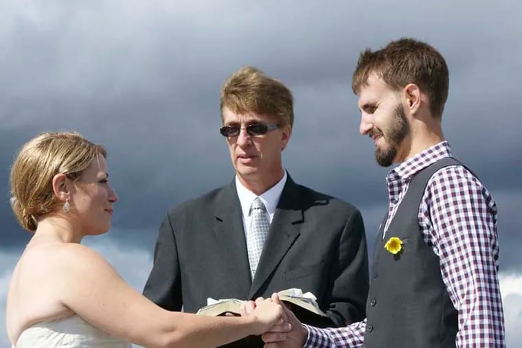 bride and groom, that is Pastor Max Simms, their officiant.Kathy Taylor and Carl Oberg
Photog: Dennis Heyman Photography