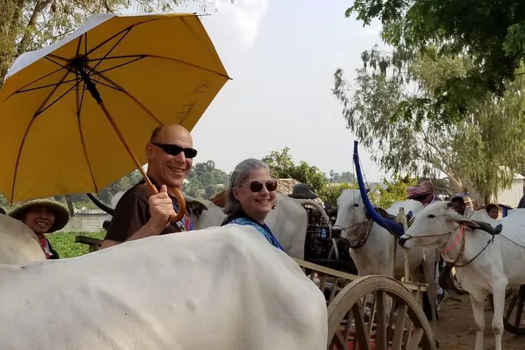 Travel agent Susan Wolfson and husband David in the Cambodian countryside during a Mekong Delta cruise that many seniors travel.