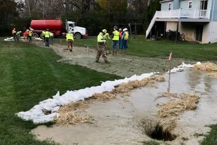 A sinkhole that developed in 2018 in the rear yard on Lisa Drive in Exton, where Sunoco Pipeline was constructing the Mariner East 2 pipeline.