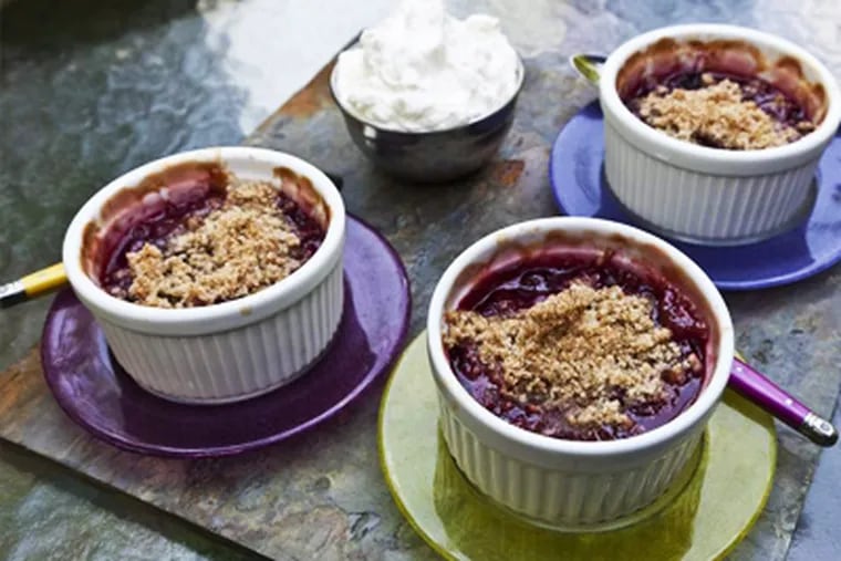 Spiced cherry crisp in individual cups; serve with whipped cream. ELISE WRABETZ / Staff Photographer