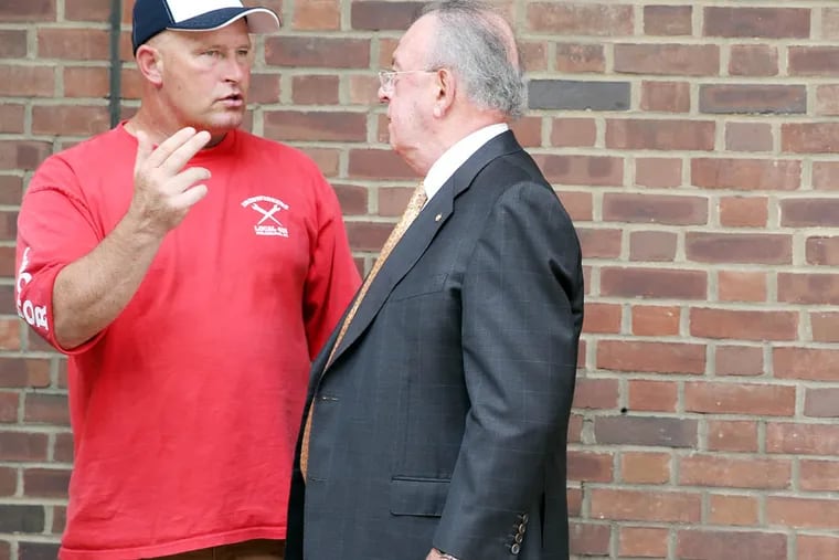 Richard Ritchie, left, talks with Joseph Dougherty, right, outside the U. S. courthouse in Philadelphia on August 14, 2014. They are two of 10 defendants in the Ironworkers RICO-conspiracy case..  DAVID MAIALETTI / Staff Photographer