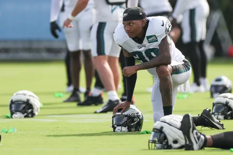 Eagles CB Eli Ricks stretches before a joint practice with the Colts on the last day of Eagles training camp at the NovaCare Complex in Philadelphia on Tuesday, Aug. 22, 2023.