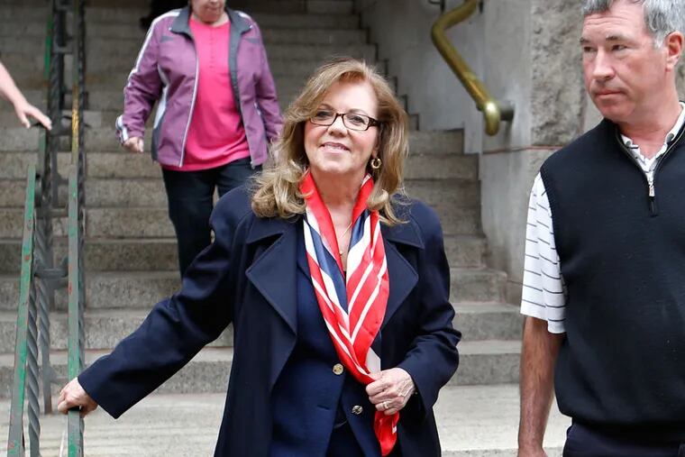 Former state Supreme Court Justice Joan Orie Melvin, left, leaves court with her husband Greg Melvin after she and her sister, Janine Orie,   were sentenced for their February convictions on corruption in Orie Melvin's election campaign, on Tuesday, May 7, 2013, in Pittsburgh. The sisters avoided prison time but were sentenced to house arrest for what a judge called crimes of "arrogance."   (AP Photo/Keith Srakocic)