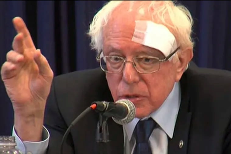 This image from video provided by WCIV-TV shows Democratic presidential candidate Bernie Sanders speaking at a health-care roundtable at the at the International Longshoremen's Association Hall on Friday, March 15 , 2019, in Charleston, S.C. Sanders was wearing a large gauze bandage on his forehead after cutting his head on a glass shower door earlier in the morning. (WCIV via AP)
