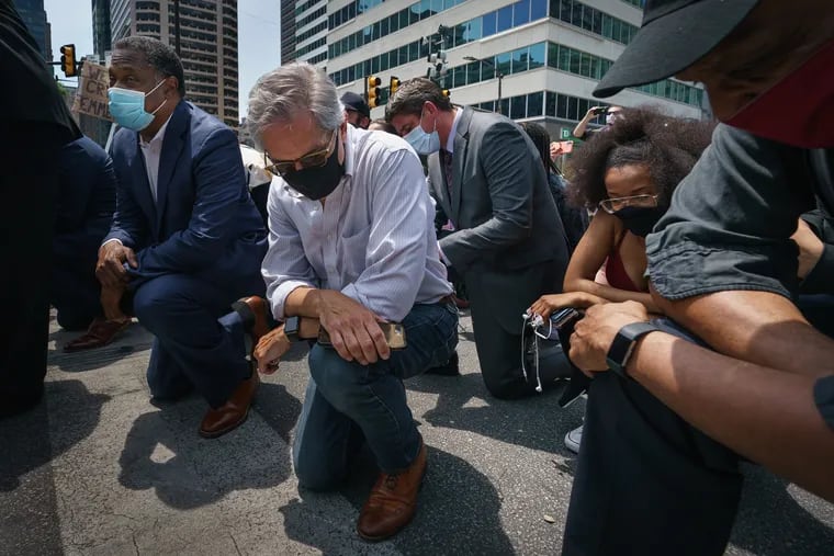 Larry Krasner takes a knee in honor of the memory of George Floyd outside Philadelphia City Hall on June 04, 2020.