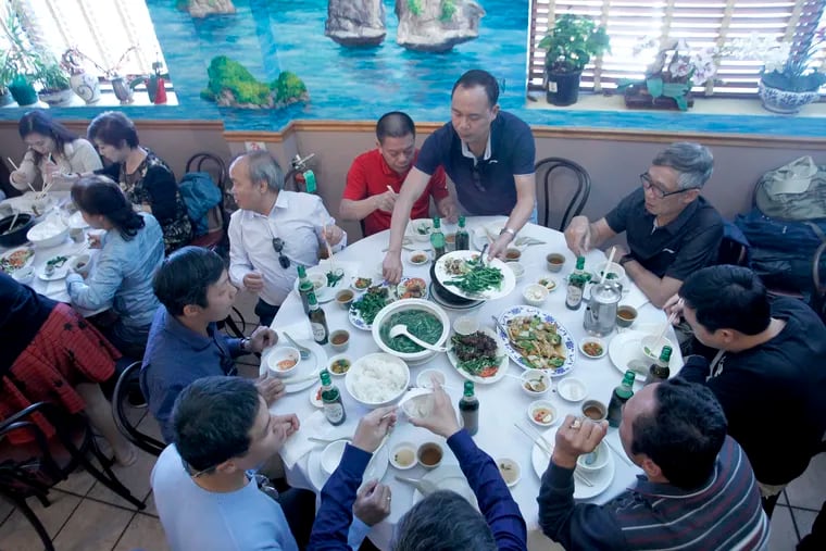 A group of Vietnamese tourists from Hanoi eat lunch at Nam Phuong restaurant after visiting the Liberty Bell. Nam Phuong has become a common stop for Vietnamese tour companies visiting the U.S.