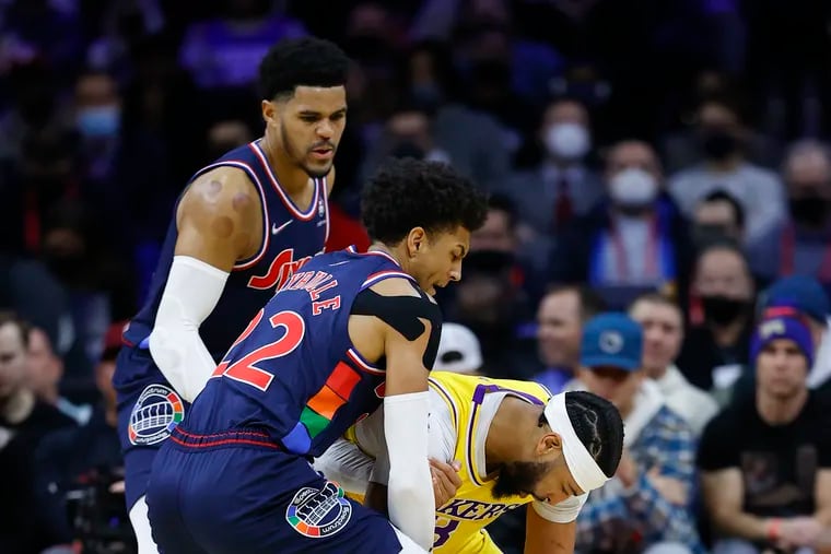 Los Angeles Lakers forward Anthony Davis loses the basketball against Sixers guard Matisse Thybulle and forward Tobias Harris in the second quarter on Thursday.