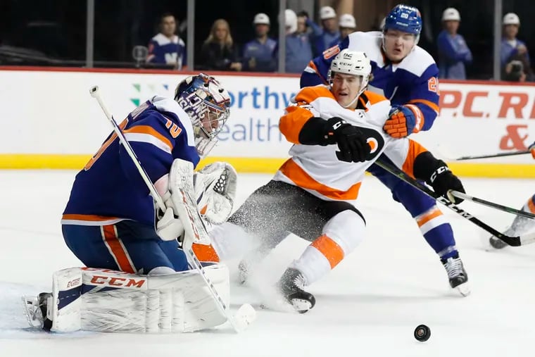 Getting pucks to the net and traffic in front of Islanders goaltender Semyon Varlamov, like Nic Aube-Kubel is doing here, is one of the keys to this series.