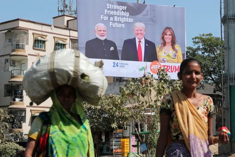 Indian women walk past a hoarding showing Indian Prime Minister Narendra Modi, President Donald Trump and first lady Melania Trump to welcome them ahead of their visit to Ahmadabad, India. Trump is scheduled to visit the city during his Feb. 24-25 India trip. American dairy farmers, distillers and drug makers have been eager to break into India, the world’s seventh-biggest economy but a tough-to-penetrate colossus of 1.3 billion people. Looks like they’ll have to wait. Talks between the Trump administration and New Delhi, intended to forge at least a modest deal in time for President Donald Trump’s visit there, appear to have fizzled. Barring some last-minute dramatics — always possible with the Trump White House — a U.S.-India trade pact is months away, if not longer.
