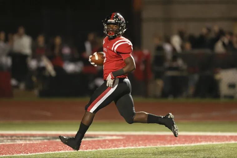 Coatesville's Dapree Bryant finishes off a 58-yard touchdown run in a 42-14 win over Downingtown West on Oct. 5