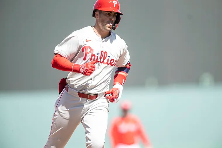 The Phillies' Whit Merrifield rounds the bases after hitting a two-run home run in the third inning against the Red Sox on Monday in Fort Myers, Fla.