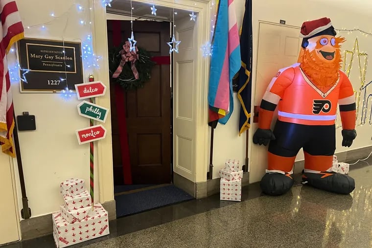 To celebrate the holidays, staff of Rep. Mary Gay Scanlon decorated the hallway outside her Capitol Hill office with Philly-themed decor, including a life-sized inflatable Gritty, a Wawa-themed tree, and a light-up Boathouse Row.